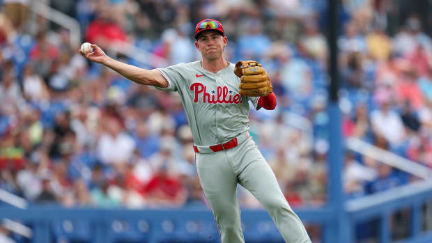Feb 29, 2024; Dunedin, Florida, USA; Philadelphia Phillies third baseman Scott Kingery (4) throws to first for an out against the Toronto Blue Jays in the fourth inning at TD Ballpark. Mandatory Credit: Nathan Ray Seebeck-USA TODAY Sports